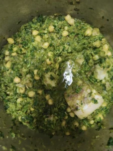 A pot of green stew with chickpeas and Beef.