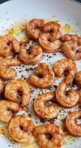 Pan-seared shrimp seasoned and browned in a skillet, ready to be added to the Marry Me Shrimp Pasta Recipe.