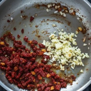 Garlic and sun dried tomatoes for Marry Me Chicken Tortellini