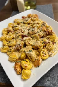 Marry Me Chicken Tortellini with basil garnish