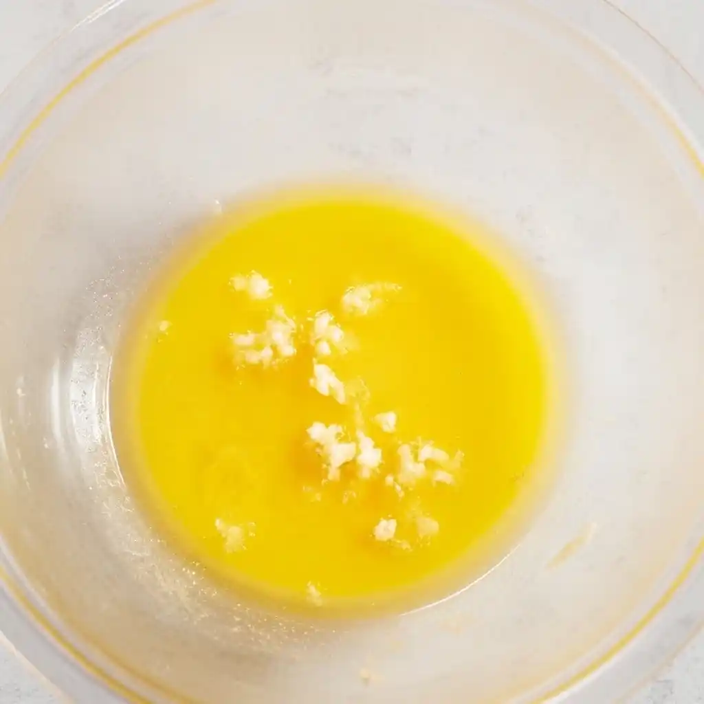 Garlic butter melting in a bowl for Air Fryer Shrimp Scampi