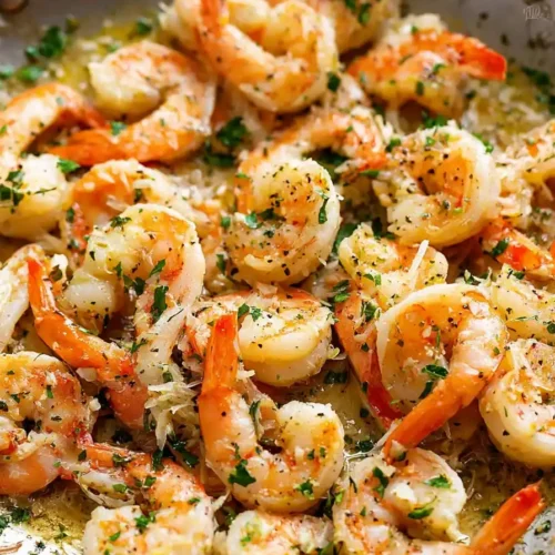 Classic Garlic Butter Shrimp Scampi served over linguine with a fresh parsley garnish.