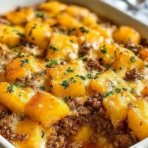 Golden-brown hobo casserole with bubbling cheese and beef filling