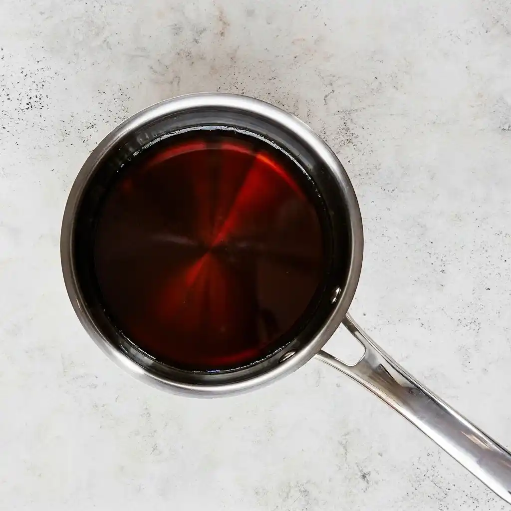 maple bourbon glaze simmering in saucepan