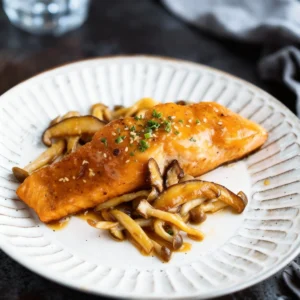 miso butter salmon plated with shiitake and shimeji mushrooms