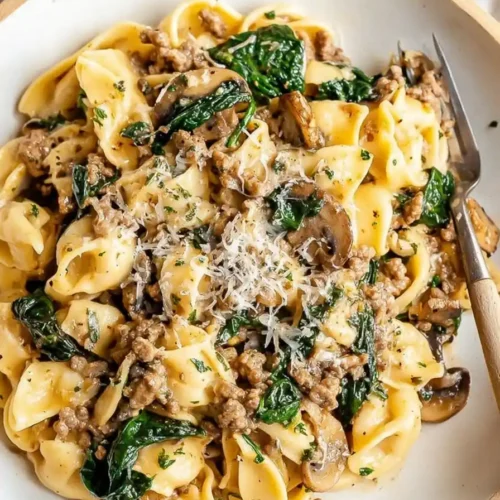 One Pot Cheesy Mushroom Spinach Beef Pasta in a creamy sauce with mushrooms and spinach