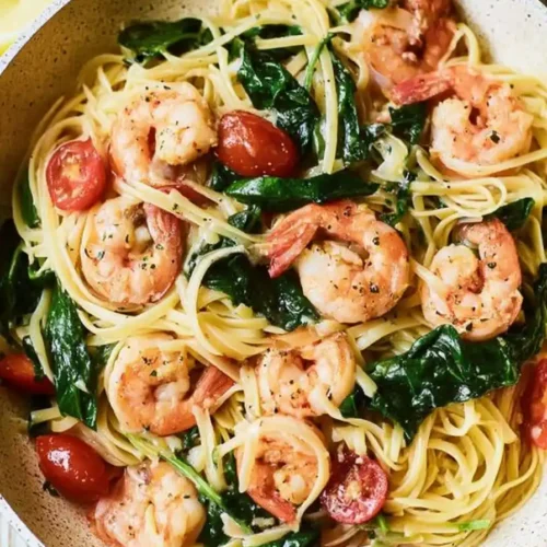 Shrimp Scampi with Spinach and Cherry Tomatoes in skillet