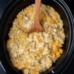 Finished Crock Pot Chicken and Rice Recipe with melted cheddar cheese