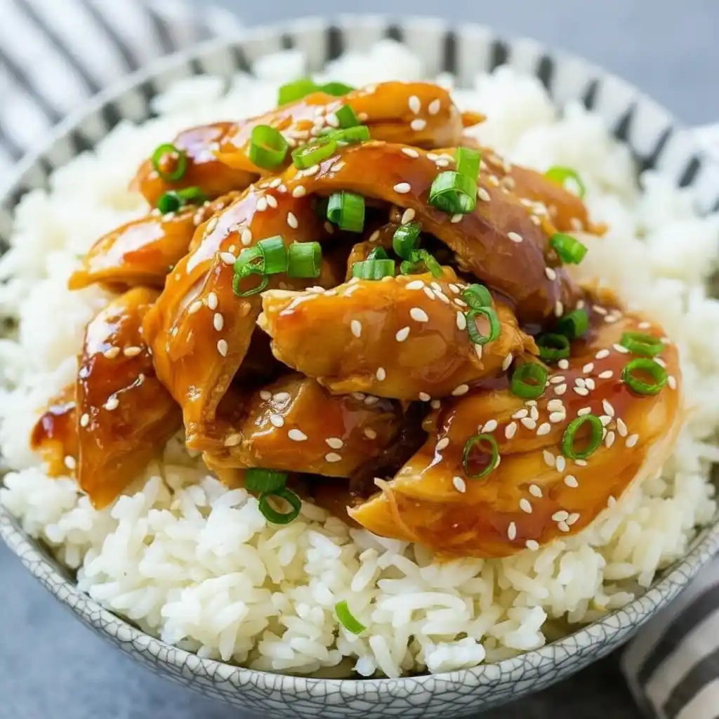 Dump and Go Teriyaki Chicken served over white rice topped with sesame seeds and green onions