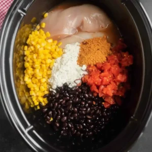 Step-by-step preparation of Fiesta Chicken Crock Pot with ingredients layered in the slow cooker