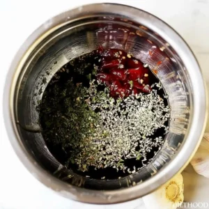 Honey garlic chicken sauce being mixed in bowl