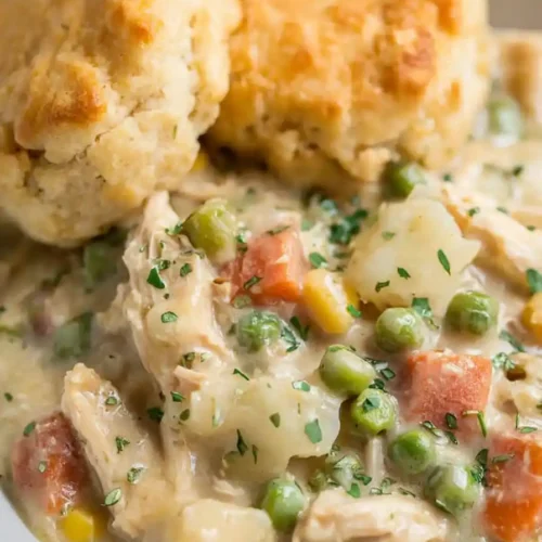 Spoonful of creamy chicken pot pie from slow cooker