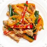 Served chicken fajita casserole with melted cheese and fresh cilantro