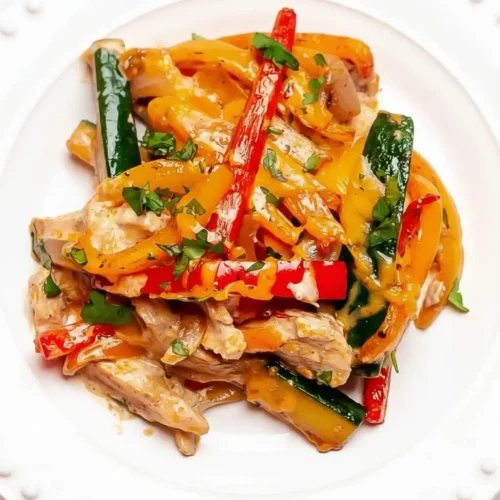 Served chicken fajita casserole with melted cheese and fresh cilantro